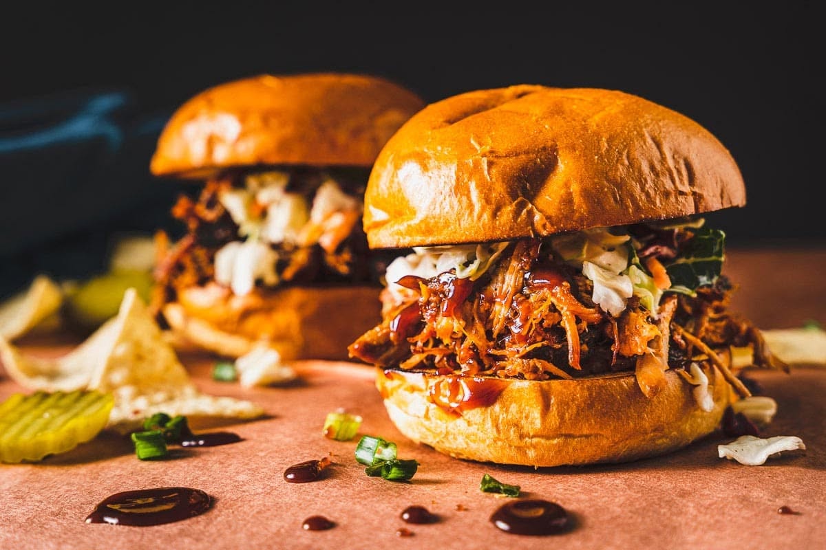 Burgers served with pickles and chips